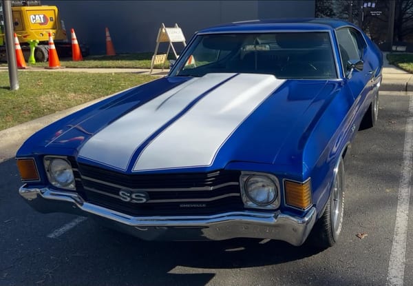 Blue Chevrolet Chevelle SS with white racing stripes